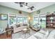 Cozy living room features lots of windows and natural lighting with comfortable seating at 511 Nandina Dr, Goose Creek, SC 29445