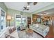Comfortable living room area featuring neutral colors, large windows and ceiling fans at 511 Nandina Dr, Goose Creek, SC 29445