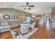 Open-concept living room with hardwood floors, ceiling fan, and access to dining area at 511 Nandina Dr, Goose Creek, SC 29445