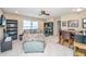 Inviting living room with neutral carpet, comfortable seating, ceiling fan, and games table at 511 Nandina Dr, Goose Creek, SC 29445