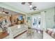 Open living area with access to the outdoor patio through glass doors and views of the stairs at 511 Nandina Dr, Goose Creek, SC 29445