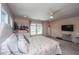 This light main bedroom features a mounted television, a large window, fresh paint, and neutral carpet at 511 Nandina Dr, Goose Creek, SC 29445