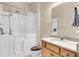 Bathroom with a walk-in tub, granite countertops, and light wood cabinets at 522 Tidewater Chase Ln, Summerville, SC 29486