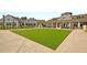 Well-manicured common green area surrounded by beautifully designed buildings and lovely landscaping at 522 Tidewater Chase Ln, Summerville, SC 29486
