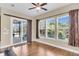 Bright dining room with hardwood floors, large windows, and sliding glass doors leading to outdoor area at 522 Tidewater Chase Ln, Summerville, SC 29486