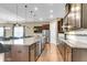 Gourmet kitchen with granite countertops, stainless steel appliances, and a large island at 522 Tidewater Chase Ln, Summerville, SC 29486
