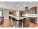 Spacious kitchen featuring a large island, stainless steel appliances, and dark wood cabinets at 522 Tidewater Chase Ln, Summerville, SC 29486