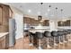 Beautiful kitchen with a large center island, stainless appliances, and dark wood cabinets at 522 Tidewater Chase Ln, Summerville, SC 29486
