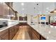 Spacious kitchen featuring dark wood cabinetry and a large granite island at 522 Tidewater Chase Ln, Summerville, SC 29486