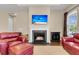 Cozy living room featuring a fireplace, TV, and comfortable seating at 522 Tidewater Chase Ln, Summerville, SC 29486