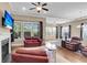 Cozy living room with a fireplace, comfortable seating, and bright natural light at 522 Tidewater Chase Ln, Summerville, SC 29486