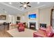 Inviting living room with a cozy fireplace and comfortable seating at 522 Tidewater Chase Ln, Summerville, SC 29486