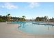 Beautiful community pool features clear water, lounge chairs, umbrellas, and lovely landscaping at 522 Tidewater Chase Ln, Summerville, SC 29486