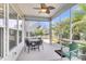 Inviting screened porch with ceiling fan and table with chairs, perfect for outdoor living at 522 Tidewater Chase Ln, Summerville, SC 29486
