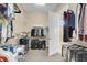 Spacious walk-in closet with ample shelving and storage space and access to the bathroom at 522 Tidewater Chase Ln, Summerville, SC 29486