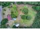A charming home with a pool, gazebo, and outbuilding nestled in a lush, green landscape at 5615 Highway 165, Ravenel, SC 29470
