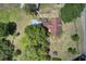 A home featuring a pool surrounded by mature trees and landscaped grounds at 5615 Highway 165, Ravenel, SC 29470