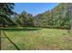 Expansive, well-maintained backyard with mature trees offers lots of space and privacy at 5615 Highway 165, Ravenel, SC 29470