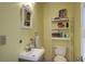 Small, clean bathroom with neutral colors, essential fixtures, and compact storage solutions at 5615 Highway 165, Ravenel, SC 29470