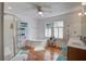 Bathroom features a corner tub, a separate glass shower, and a double vanity with hardwood floors at 5615 Highway 165, Ravenel, SC 29470
