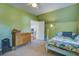Green painted bedroom features an inviting bed and a dresser for storage at 5615 Highway 165, Ravenel, SC 29470