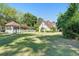 Exterior of house with large yard, gazebo, and mature landscaping at 5615 Highway 165, Ravenel, SC 29470