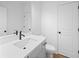 Modern bathroom features a sleek vanity, toilet, and white doors, offering a clean design at 5655 Captain Kidd Rd, Hollywood, SC 29449