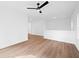 Bright bonus room with neutral walls, ceiling fan, and hardwood floors at 5655 Captain Kidd Rd, Hollywood, SC 29449