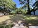 Large backyard with mature trees and grass at 6086 Chisolm Rd, Johns Island, SC 29455