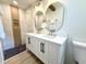 Bathroom with double sink vanity, new fixtures, and marble-tiled shower, providing a spa-like experience at 6086 Chisolm Rd, Johns Island, SC 29455