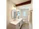 Bathroom with double sink vanity, new fixtures, and marble-tiled shower, providing a spa-like experience at 6086 Chisolm Rd, Johns Island, SC 29455