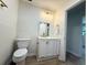 Bathroom featuring white vanity with storage and drawers, toilet, and a gold faucet at 6086 Chisolm Rd, Johns Island, SC 29455