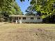Inviting single-story home with newly updated windows and a tidy landscaped front yard at 6086 Chisolm Rd, Johns Island, SC 29455