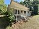 Charming home with a welcoming front porch, white railings, and lush greenery at 6086 Chisolm Rd, Johns Island, SC 29455