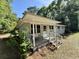 Charming home with a cozy front porch and brick foundation, bench, and updated railing at 6086 Chisolm Rd, Johns Island, SC 29455