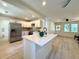 Bright kitchen with white cabinets, stainless steel appliances, and a kitchen island at 6086 Chisolm Rd, Johns Island, SC 29455