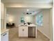Bright kitchen with an island, stainless steel dishwasher, and view into the living room at 6086 Chisolm Rd, Johns Island, SC 29455
