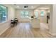 Open kitchen and dining area with lots of light and eat-in island at 6086 Chisolm Rd, Johns Island, SC 29455