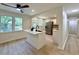 Bright, open kitchen with an island, stainless steel refrigerator, and access to backyard at 6086 Chisolm Rd, Johns Island, SC 29455