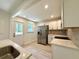Bright kitchen featuring stainless steel appliances, white cabinets, and quartz countertops at 6086 Chisolm Rd, Johns Island, SC 29455