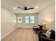 Bright and airy living room with wood-look flooring and modern ceiling fan and lots of natural light at 6086 Chisolm Rd, Johns Island, SC 29455
