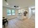 Open living space with new flooring, lots of natural light, leading to a bright kitchen with a quartz countertop island at 6086 Chisolm Rd, Johns Island, SC 29455