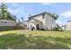 Back exterior view of home with patio area, fire pit and fenced backyard at 707 Jancus St, Charleston, SC 29414