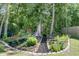 The backyard features landscaping, a playhouse, and a trampoline at 707 Jancus St, Charleston, SC 29414