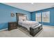 Spacious bedroom with a luxurious bed, dark wood furniture, and shuttered windows at 707 Jancus St, Charleston, SC 29414