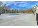 Community pool with a large pool deck surrounded by lush landscaping at 707 Jancus St, Charleston, SC 29414