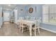 Light-filled dining room with a table set for four, accented by modern decor and a calming color scheme at 707 Jancus St, Charleston, SC 29414