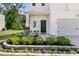 Home exterior features a welcoming door and well-manicured landscaping and a two-car garage at 707 Jancus St, Charleston, SC 29414