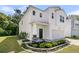 Inviting two-story home featuring manicured landscaping, a welcoming entrance, and a two-car garage at 707 Jancus St, Charleston, SC 29414