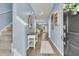 Bright foyer showcasing stylish decor, including a decorative table, mirror, and a staircase at 707 Jancus St, Charleston, SC 29414